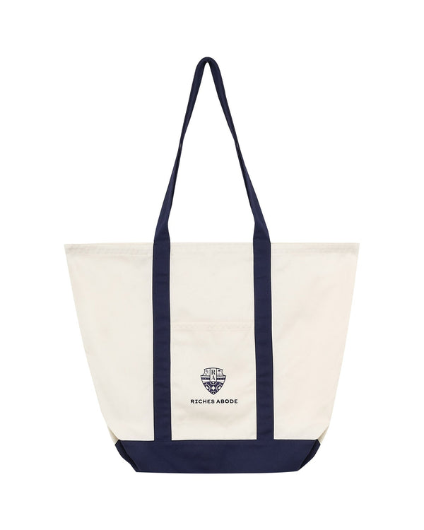 Anna tote bag by Riches Abode in a sleek white and navy colorway. Spacious, sustainable, and perfect for daily errands