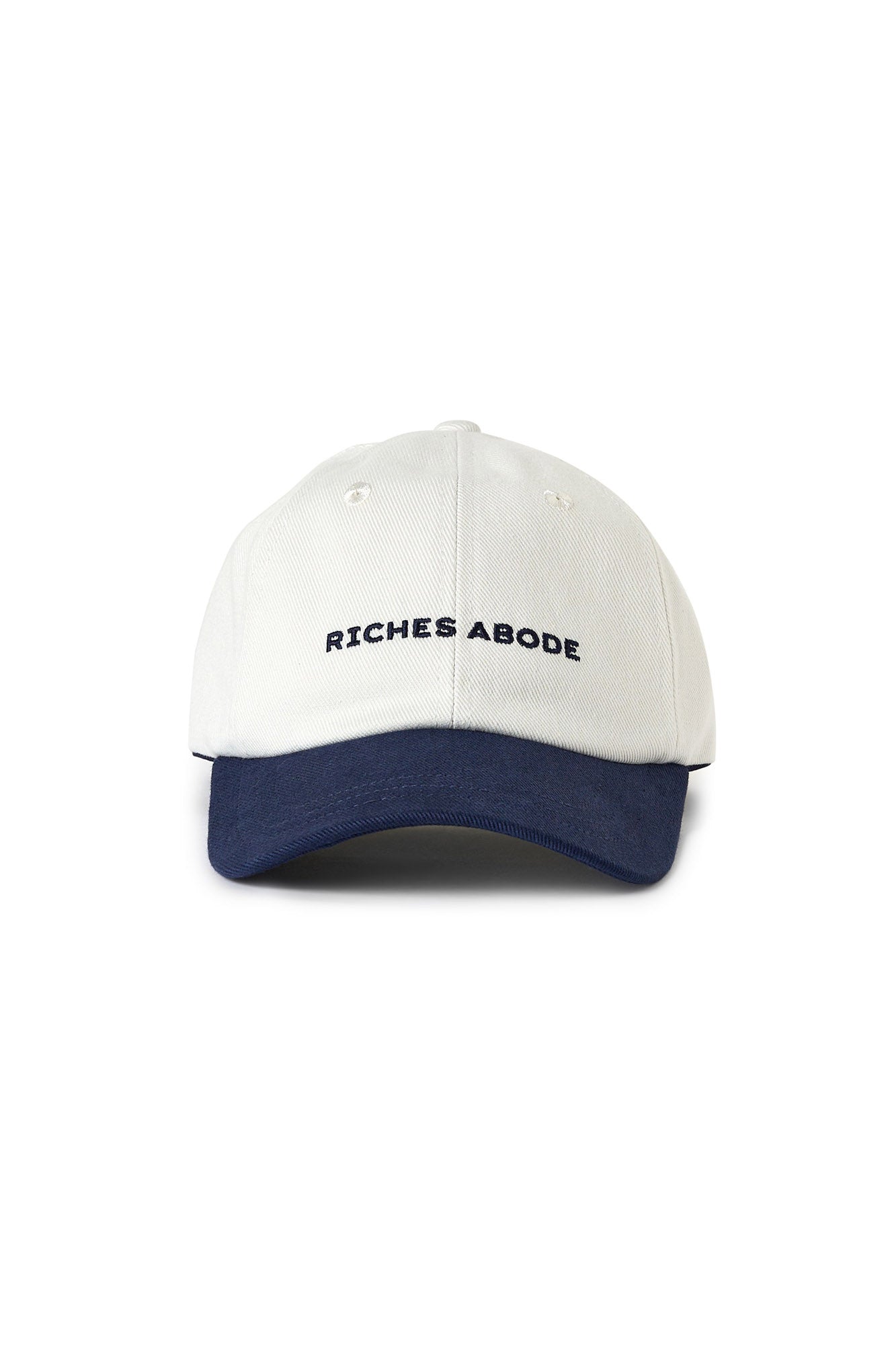 Riches Abode cap in white and navy, designed with a clean, modern look and sustainable materials. Perfect for casual outings