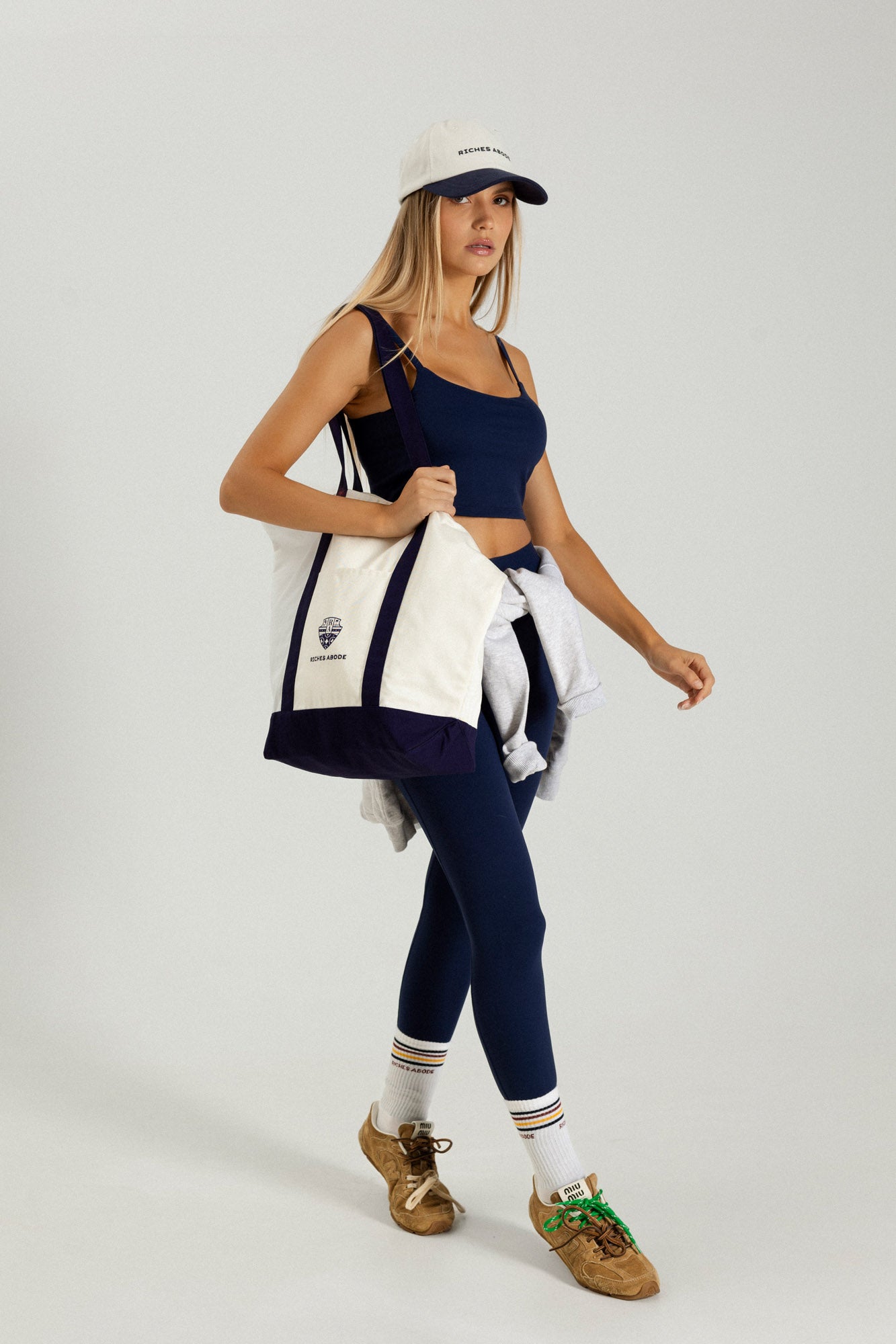Riches Abode Anna tote bag in white and navy, made with durable materials for eco-conscious style. Spacious and versatile for everyday use