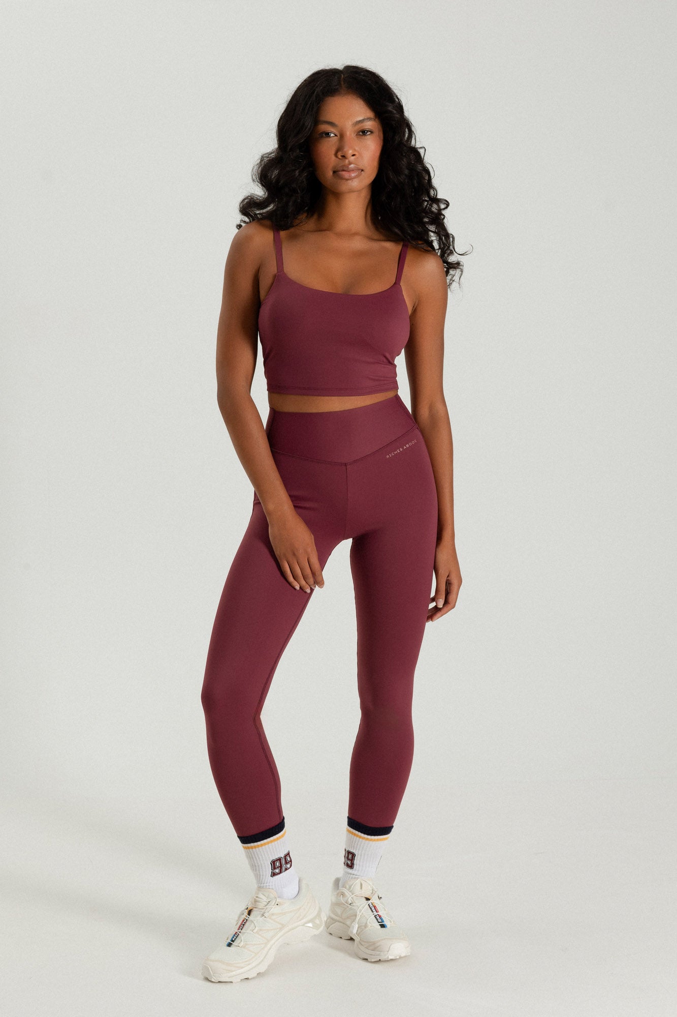 Riches Abode active set in Bordeaux, featuring Steffi leggings and a matching tank bra. Made with breathable, durable materials for active lifestyles