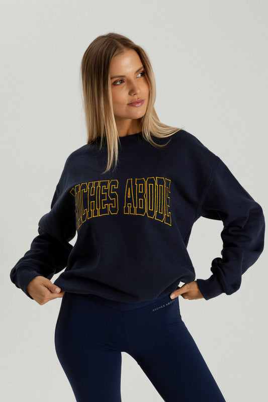 Riches Abode navy sweatshirt, crafted from breathable and durable fabric. A timeless wardrobe essential for sustainable living